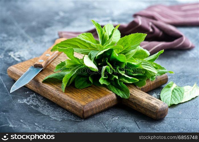 fresh mint on board and on a table