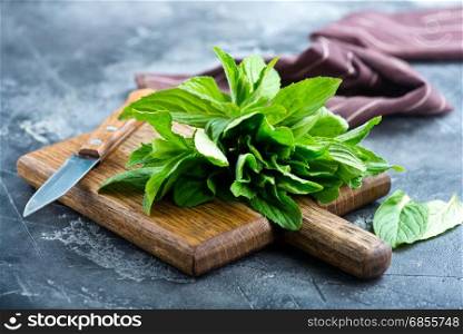 fresh mint on board and on a table