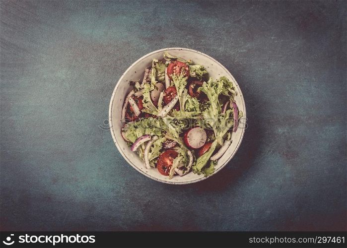 Fresh mixed salad with tomatoes, top view