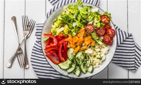 Fresh mixed salat with herbs and mushrooms, top view,