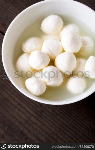 Fresh mozzarella cheese balls in a bowl