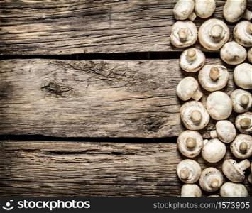 Fresh Mushrooms . On wooden background. Top view. Fresh mushrooms . On wooden background.