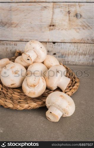 Fresh mushrooms on wooden table. Collecting mushrooms for delicious food