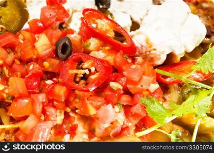 fresh nachos and vegetable salad with meat ,chili con carne ,tipycal mexican food