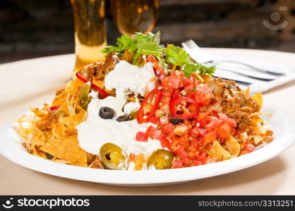 fresh nachos and vegetable salad with meat ,chili con carne ,tipycal mexican food