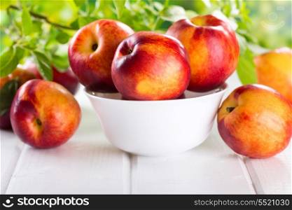 fresh nectarines on wooden table