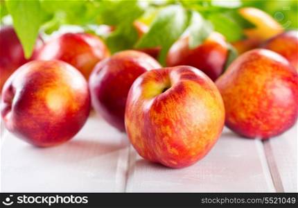 fresh nectarines on wooden table