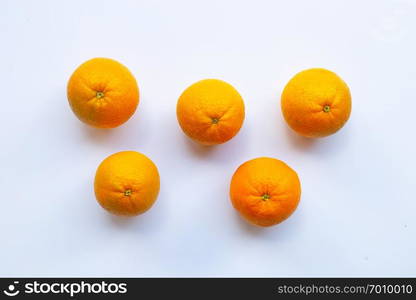 Fresh orange citrus fruit on white wooden background.  Top view