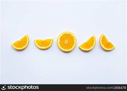 Fresh orange citrus fruit slices on white background.