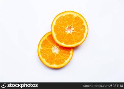 Fresh orange citrus fruit slices on white background.