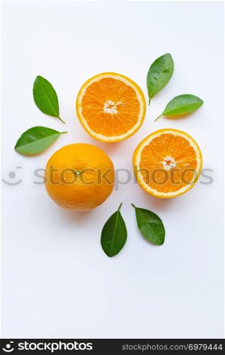 Fresh orange citrus fruit slices with leaves on white background. Top view