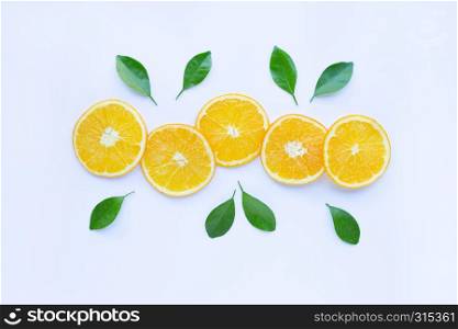 Fresh orange citrus fruit with leaves isolated on white background