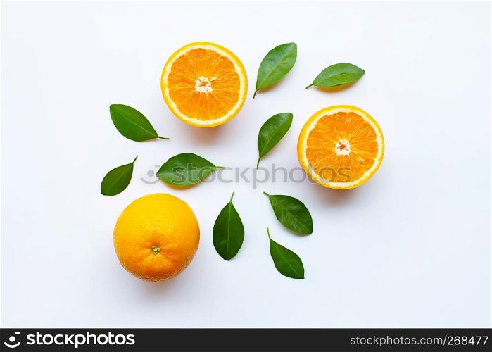Fresh orange citrus fruits with leaves on white background.