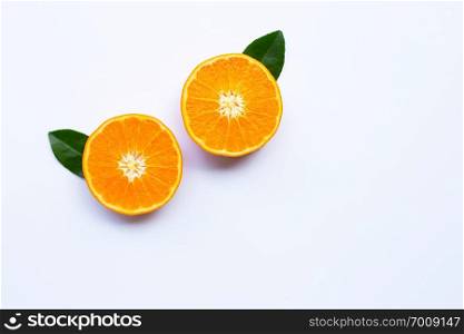 Fresh orange citrus fruits with leaves on white background.  copy space