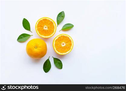 Fresh orange citrus fruits with leaves on white background. Top view