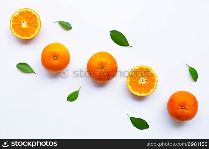 Fresh orange citrus fruits with leaves on white background. Top view