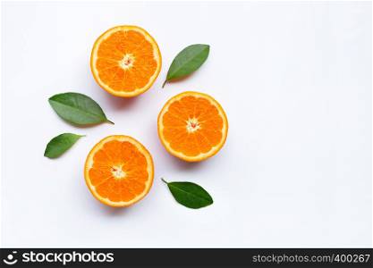 Fresh orange citrus fruits with leaves on white background. Top view with copy space