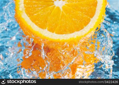 fresh orange in streaming water