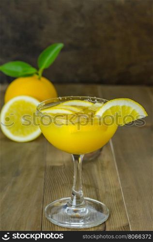 Fresh orange juice. Fresh orange juice on wooden table over grunge background
