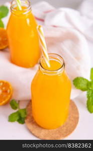 Fresh orange juice in glass  jar with mint, fresh fruits. selective focus.