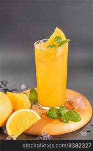 Fresh orange juice in glass with mint, fresh fruits. selective focus.