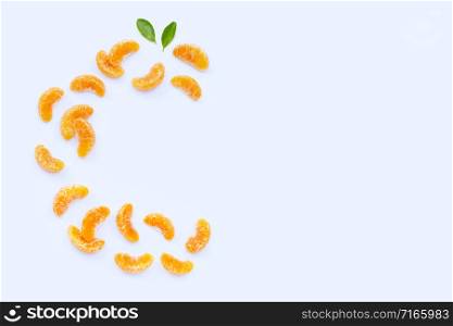 Fresh orange segments, High vitamin C, Letter C made of citrus fruits on white background. Copy space