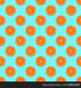 Fresh orange tangerine slices seamless pattern. Close up of citrus fruit on blue background. Studio photography.. Fresh orange tangerine slices seamless pattern. Close up of citrus fruit background. Studio photography.