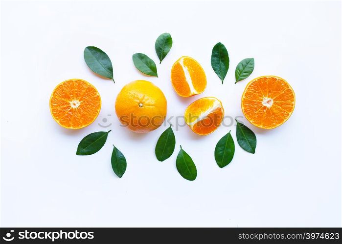 Fresh orange with green leaves isolated on white background.