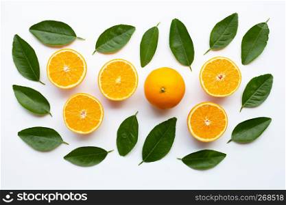 Fresh orange with green leaves on white background. Top view
