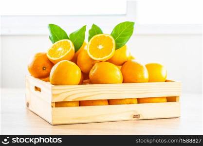 Fresh oranges fruit on wood table - Healthy food concept