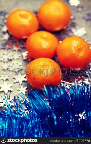 Fresh oranges over Christmas decorations