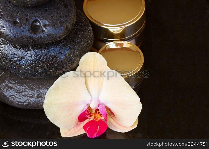 fresh orchid flower spa treatment with massage stones . orchid spa treatment
