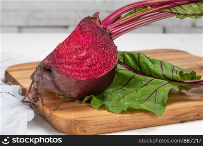 Fresh organic beet, beetroot on wooden table. Close up.
