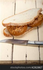 fresh organic bread over rustic table macro closeup