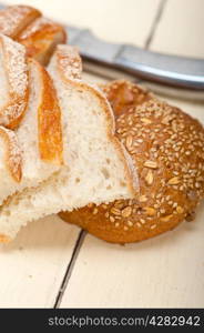 fresh organic bread over rustic table macro closeup