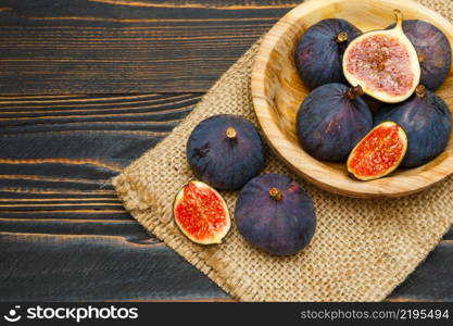 Fresh Organic Fig isolated on wooden background. Fig isolated on wooden background