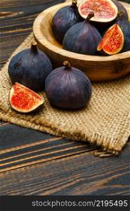 Fresh Organic Fig isolated on wooden background. Fig isolated on wooden background