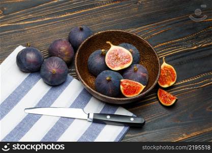 Fresh Organic Fig isolated on wooden background. Fig isolated on wooden background