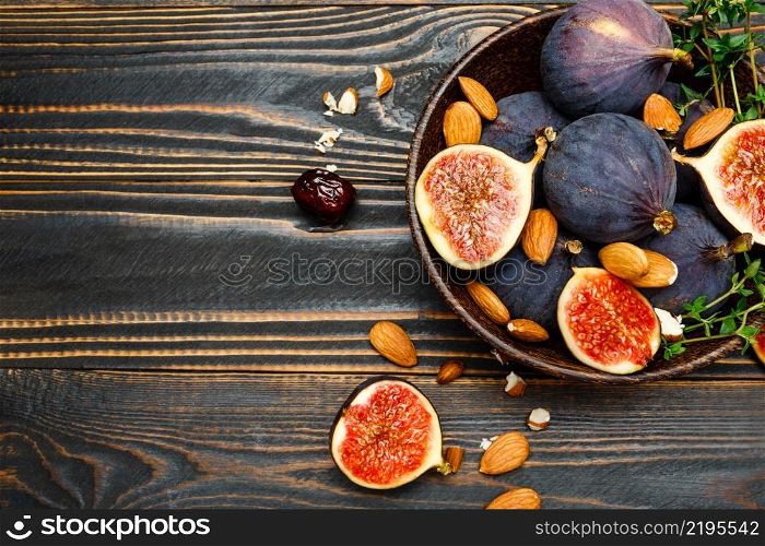 Fresh Organic Figs and nuts on wooden background or table. Figs and nuts on wooden background