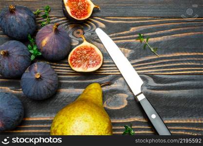 Fresh Organic Figs on wooden background or table. Figs on wooden background