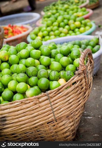 Fresh Organic Limes Piled In Boxes At Farmers Market