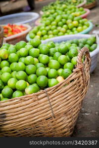 Fresh Organic Limes Piled In Boxes At Farmers Market