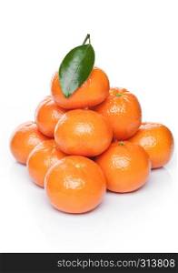 Fresh organic mandarins tangerines fruits with leaves on white background