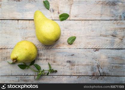 Fresh organic pears on old wood. Fruit background. Pear autumn harvest.