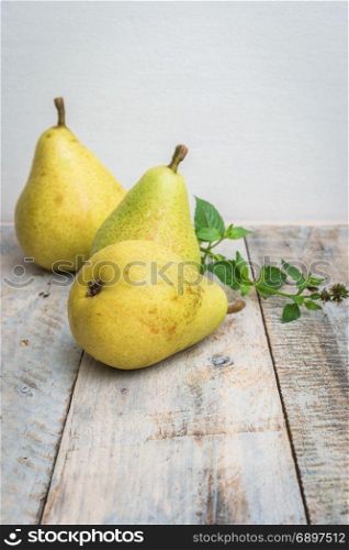 Fresh organic pears on old wood. Fruit background. Pear autumn harvest.