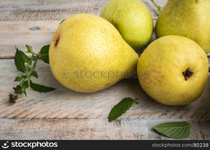 Fresh organic pears on old wood. Fruit background. Pear autumn harvest.