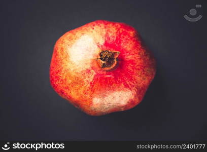 Fresh organic pomegranate isolated on black background. Pomegranate isolated on black background