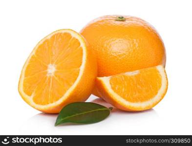 Fresh organic raw oranges with peeled halves with leaves on white background
