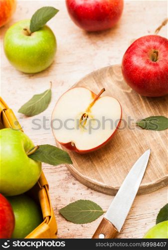 Fresh organic red and green on chopping board on wooden background