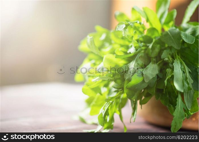 Fresh organic rucola leaves. Fresh organic rucola leaves on a wooden table
